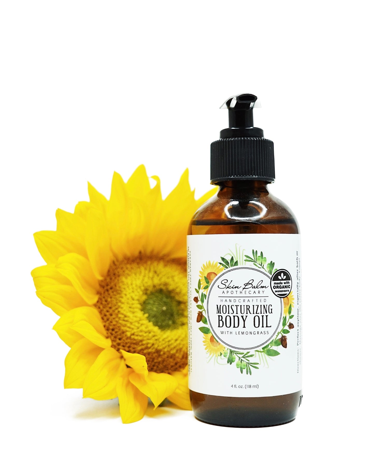 Lemongrass Moisturizing Body Oil with a sunflower against a white background.