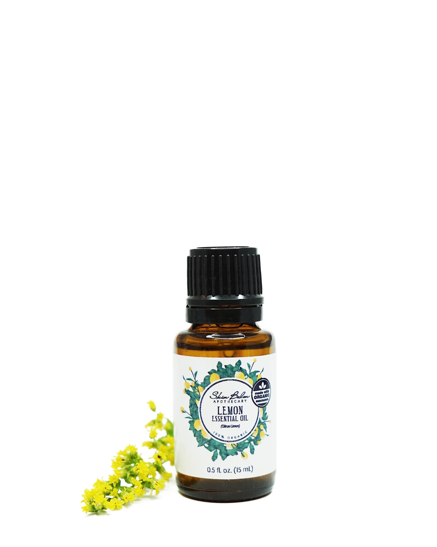Organic Lemon Essential Oil with yellow flowers against a white background.