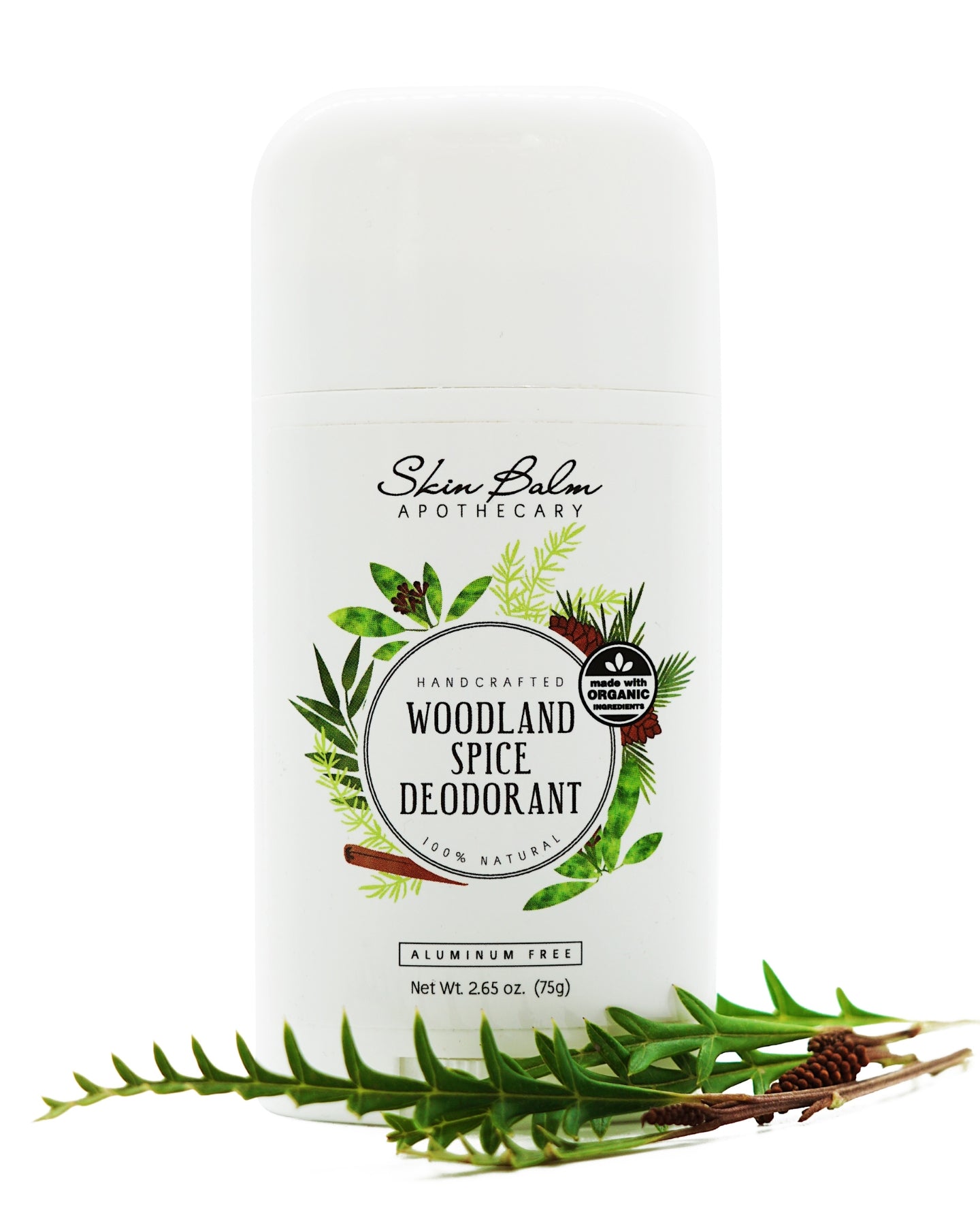Woodland Spice Deodorant with an evergreen stem against a white background.
