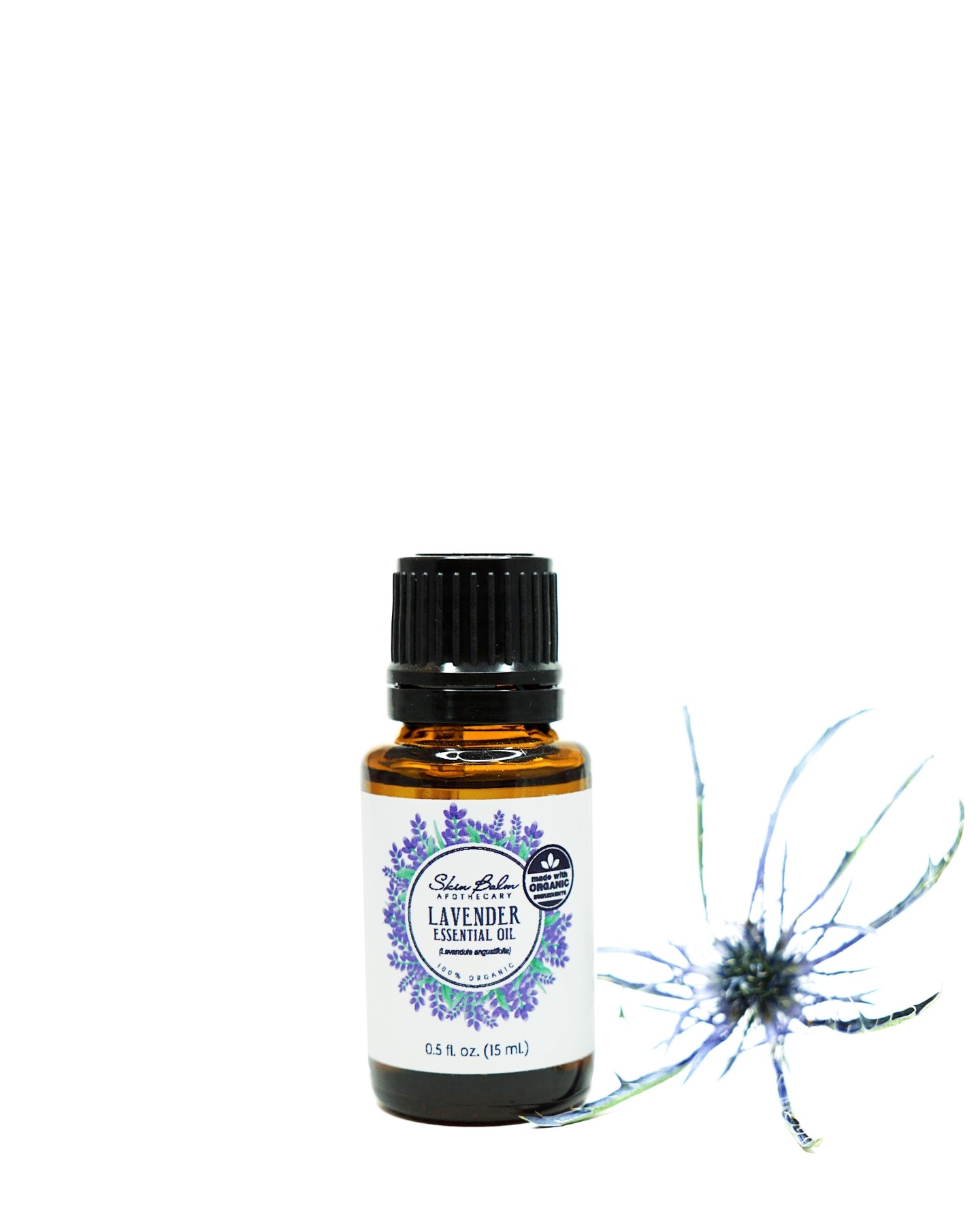 Organic Lavender Essential Oil with purple flower against a white background.